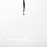 Close-up of MSY crystal sound healing pyramid against a white background.