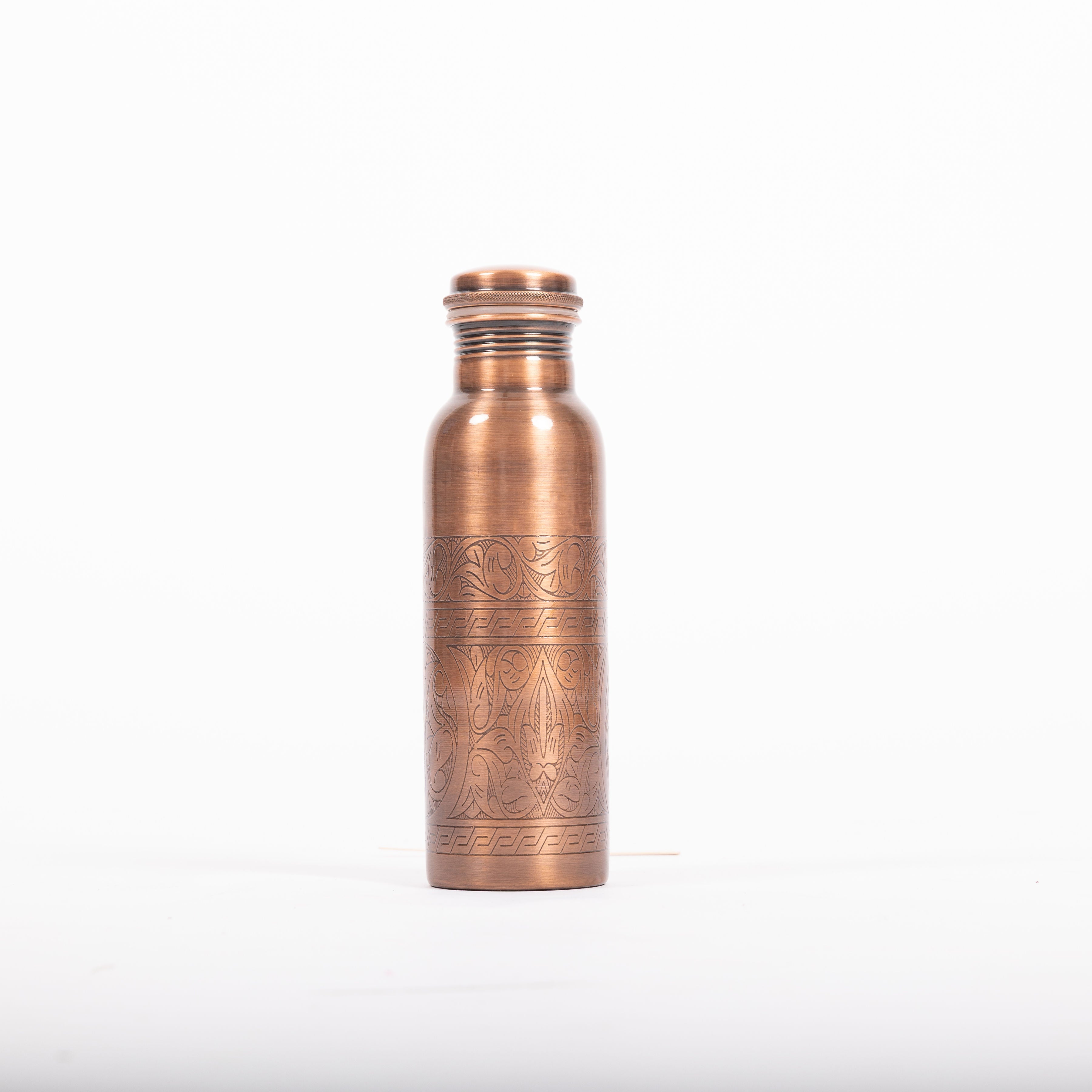 Maya Shanti Yoga Copper Etched 750ml Water Bottle with lid screwed on, on a white background.