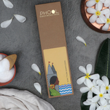Phool Nagchampa incense sticks refill pack box on a grey textured surface surrounded by white flowers.