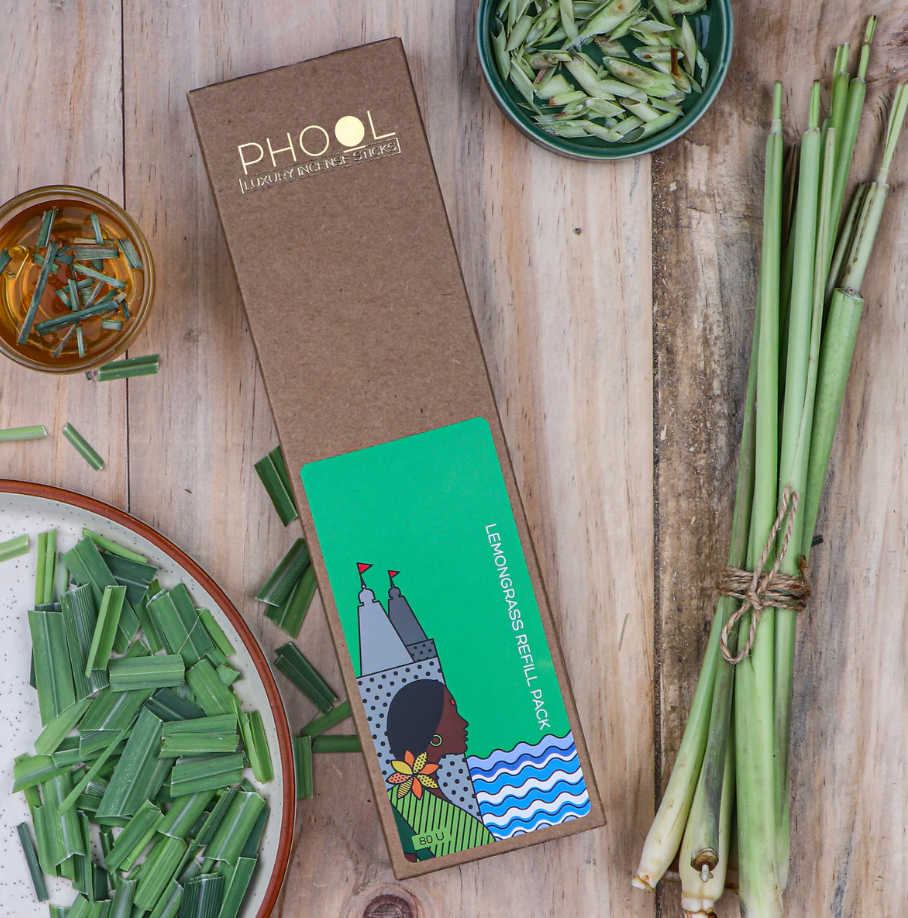 PHOOL lemongrass refill pack on a wooden surface with lemongrass stalks and leaves.