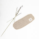 A small MSY Lavender Eye Pillow - Hemp, Lavender & Linseed with a lavender flower on it, perfect for mindfulness practice.