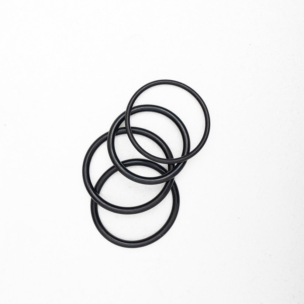 Four Maya Shanti Yoga O-rings For Crystal Bowls on a white background ideal for using as a base for crystal singing bowls.