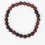Close-up of MSY Tiger Eye Mala Bracelet on a white background.