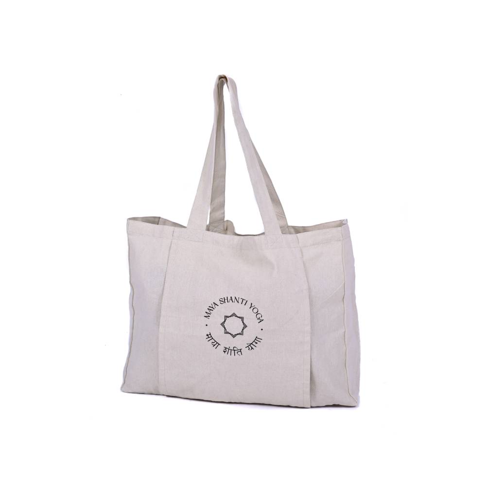 A white MSY Yoga Totebag - Cotton with the Maya Shanti Yoga logo on it, perfect for the gym, the studio or for the shops.