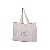 A white MSY Yoga Totebag - Cotton with the Maya Shanti Yoga logo on it, perfect for the gym, the studio or for the shops.