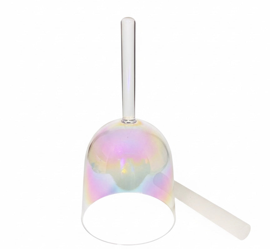 Multicolored glass with a straw on a white background