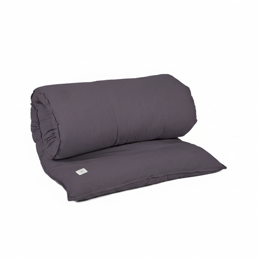 Folded anthracite grey MSY Shiatsu Mat with a tag on a white background