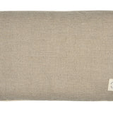 Introducing the Yoga Pillow by Maya Shanti Yoga, a rectangular beige cushion crafted from sustainable hemp with a rough texture and adorned with a visible fabric tag on the bottom right corner.