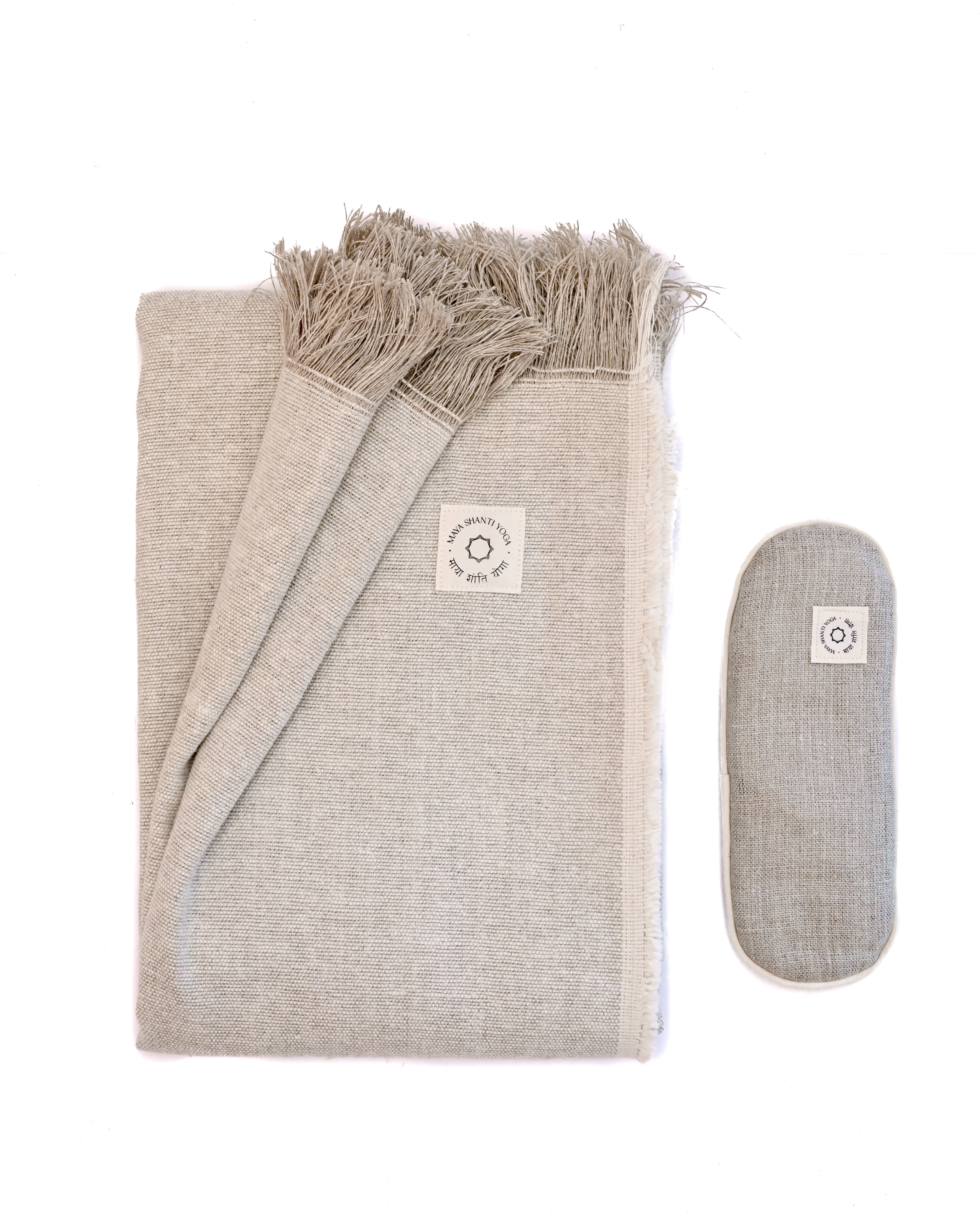 A MSY Relaxation Bundle from Maya Shanti Yoga, including a blanket and eye pillow, on a white background, perfect for meditation.