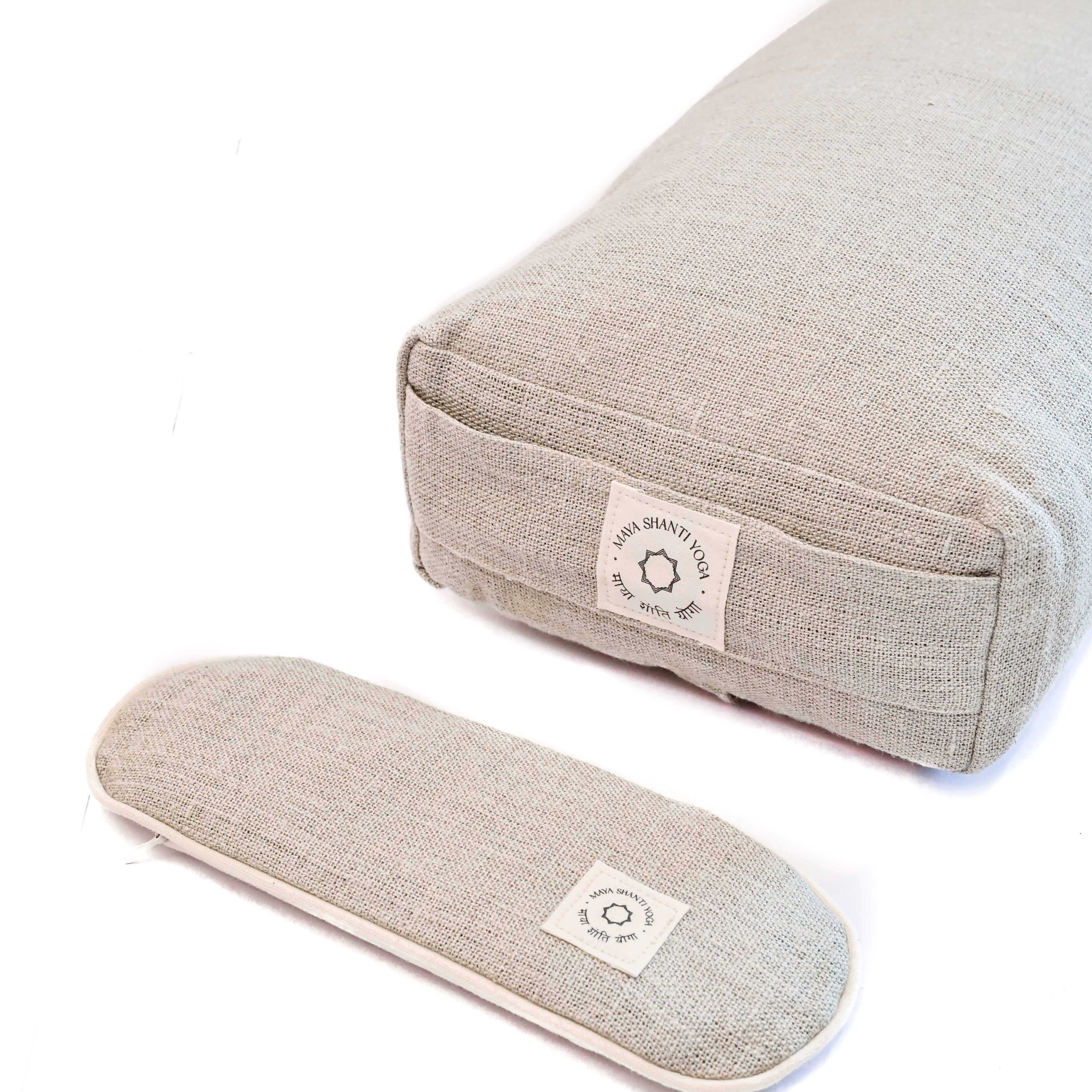 A Maya Shanti Yoga Unwinding Bundle consisting of a Lavender Eye Pillow and a Small Rectangular Bolster, perfect for meditation and relaxation.