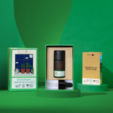 Rosemary Essential oil bottle with packaging and usage guide on a green background