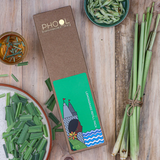PHOOL lemongrass refill pack on a wooden surface with lemongrass stalks and leaves.