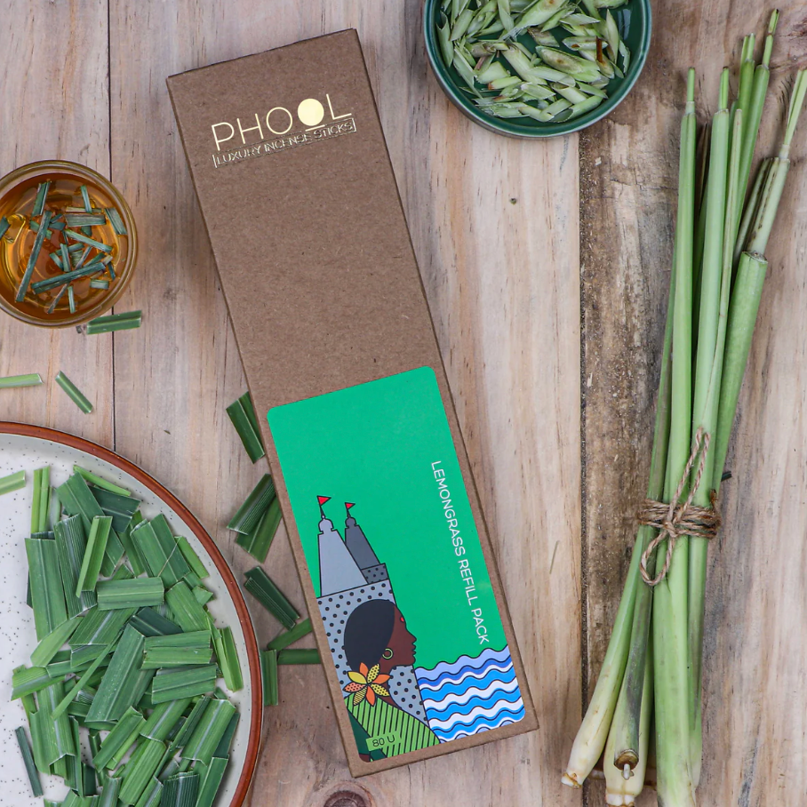 PHOOL lemongrass refill pack on a wooden surface with lemongrass stalks and leaves.