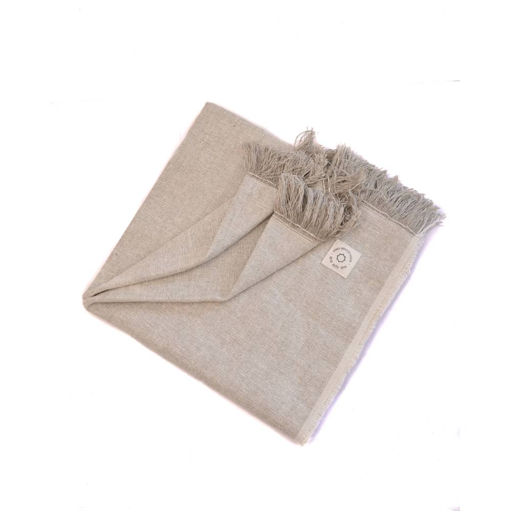 Folded MSY Meditation Yoga Blanket - Hemp & Organic Cotton scarf with frayed edges, made from sustainable materials, on a white background.