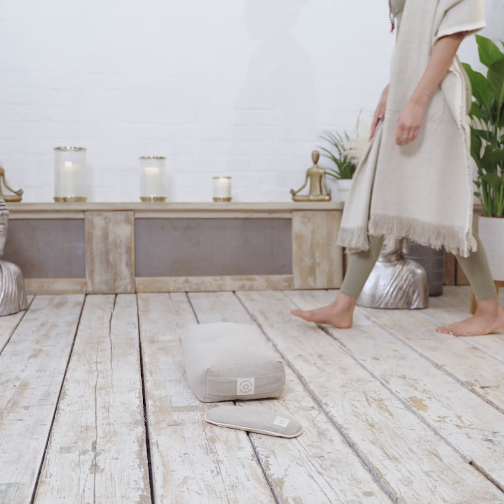 A video of a woman using a set of MSY Meditation Starter Bundles from Maya Shanti Yoga in a natural hemp colour, while practising  mindfulness and meditation.