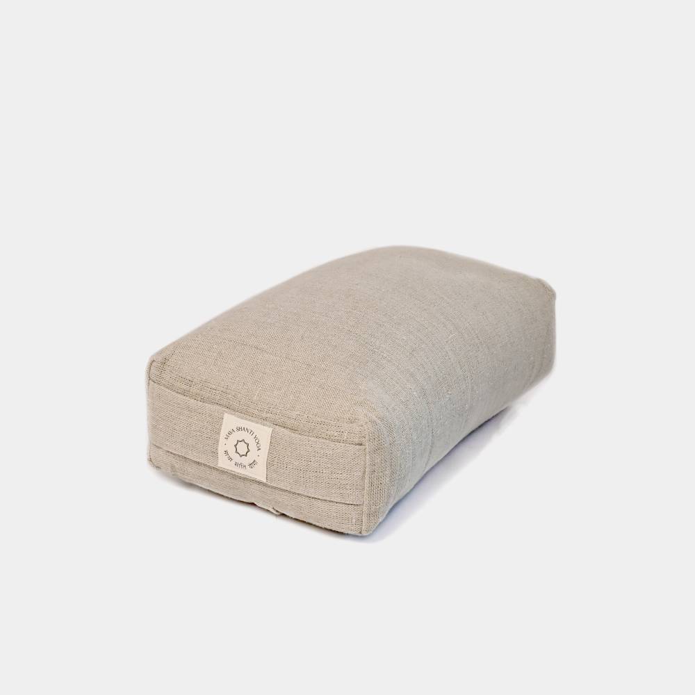 A large rectangular beige meditation cushion with buckwheat hull filling, featuring a visible Maya Shanti Yoga label on a white background.